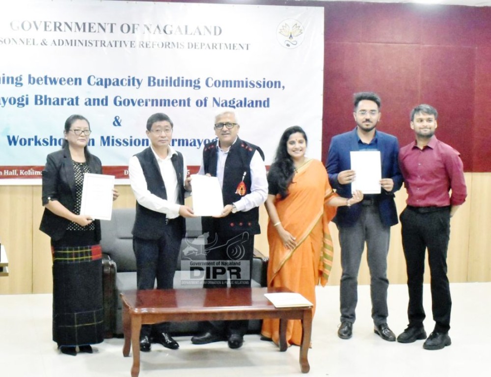 Nagaland Chief Secretary, Sentiyanger Imchen with Dr Balasubramaniam, Member-HR, Capacity Building Commission and others during the singing of MoU. (DIPR Photo)